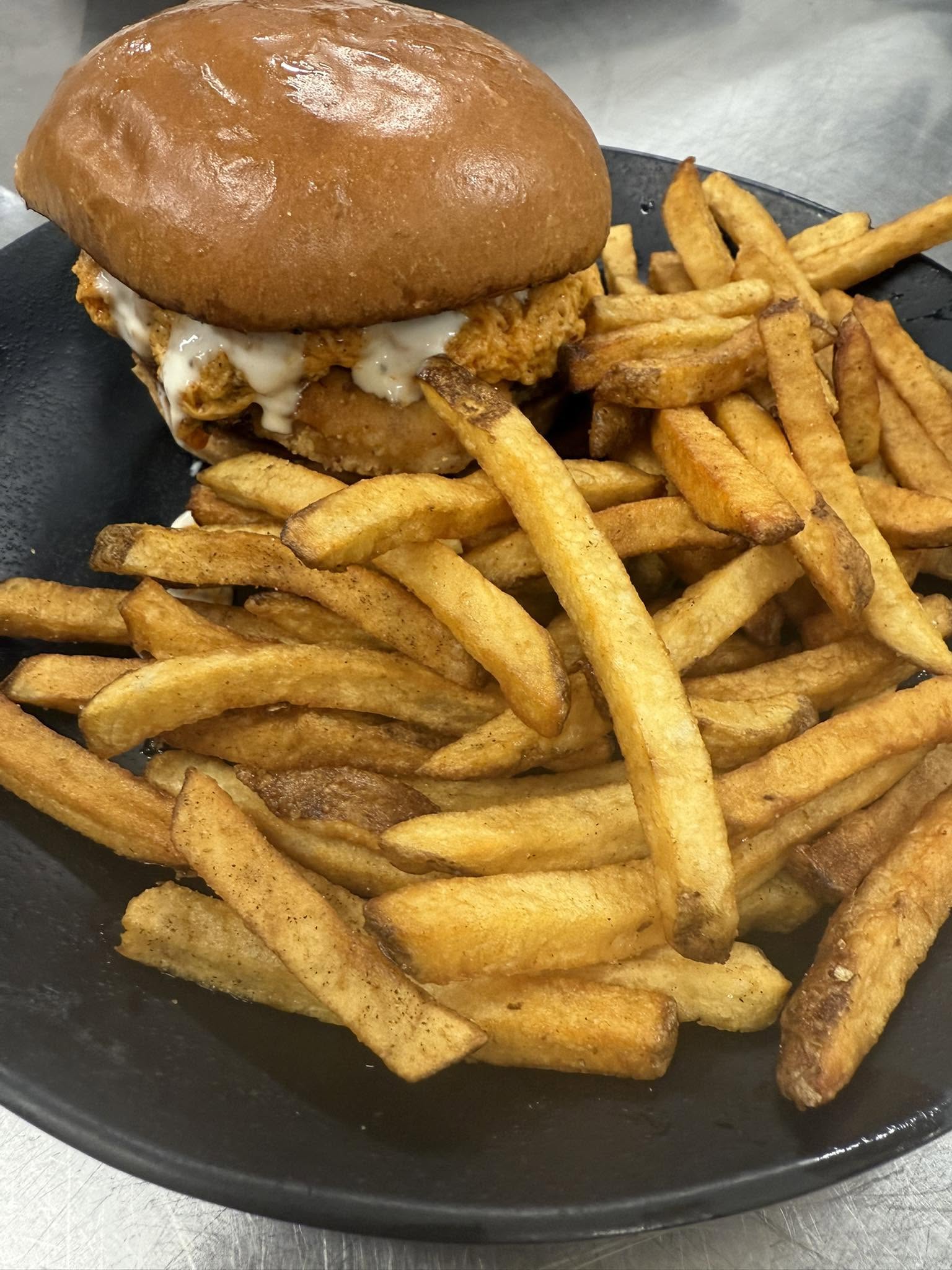 Chicken sandwich and hand-cut fries from Fat Bottom Grille